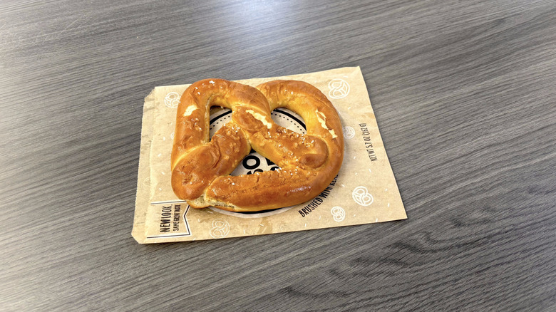 Sam's Club salted pretzel on paper bag on table