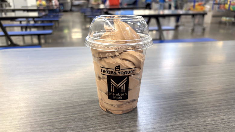 Sam's Club chocolate frozen yogurt in plastic cup on table in food court