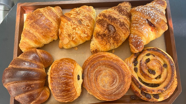 eight brown pastries on tray