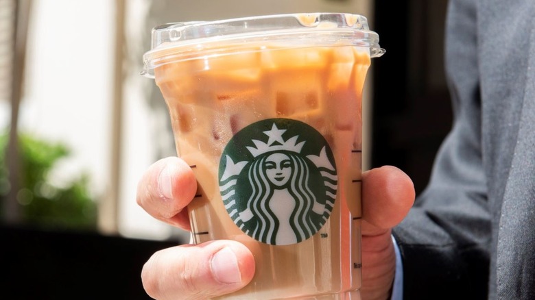 Person holding Starbucks latte