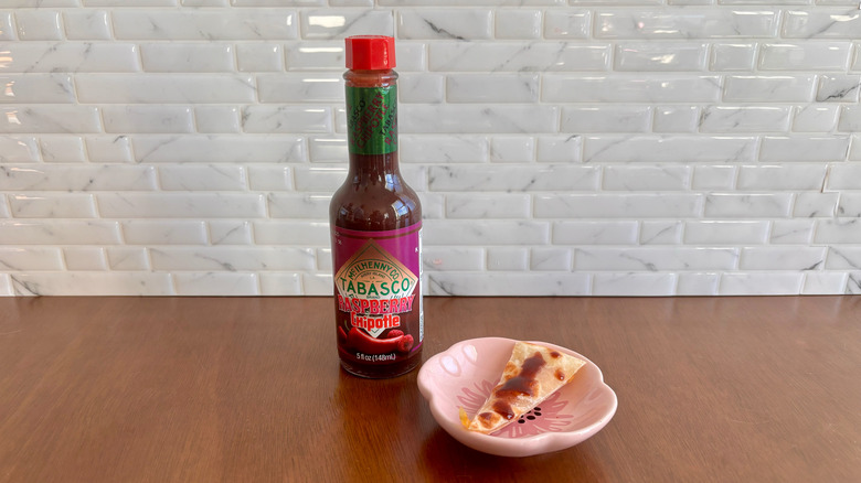 Tabasco Raspberry Chipotle sauce next to quesadilla slice