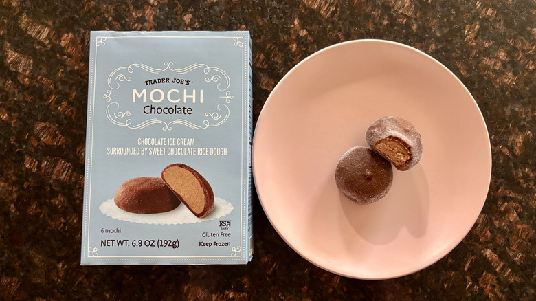 Trader Joe's chocolate mochi box next to mochi on plate