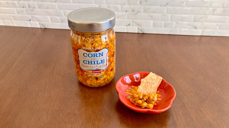 Trader Joe's corn salsa next to chip on plate