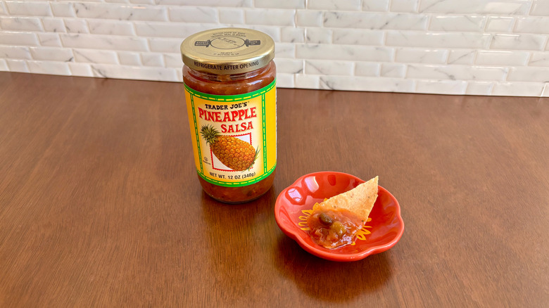 Trader Joe's pineapple salsa next to chip on plate