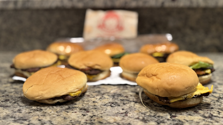 Almost every Wendy's burgers displayed on counter by bag