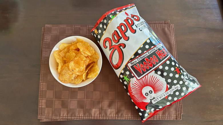 Bowl of Zapp's Voodoo Heat chips next to open bag