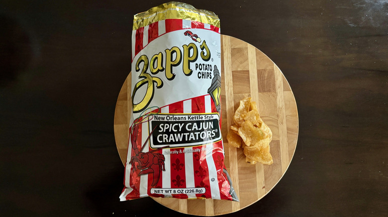 Bag of Spicy Cajun Crawtators on cutting board