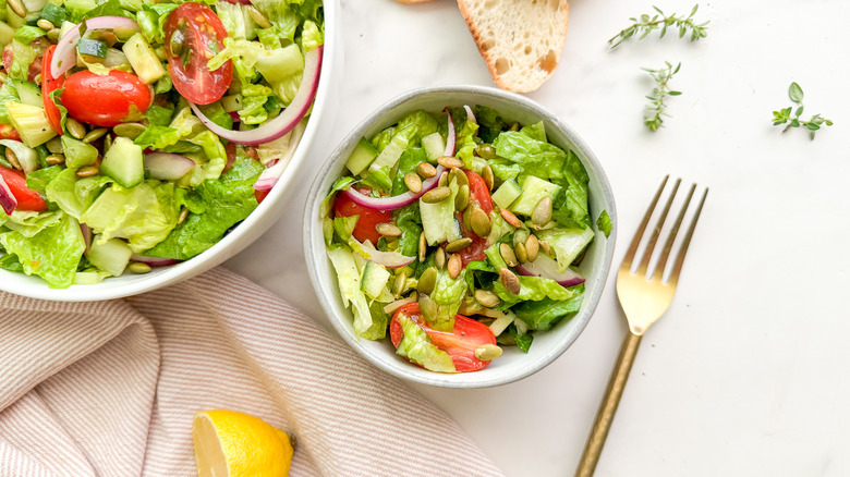 serving bowl of romaine tomato salad