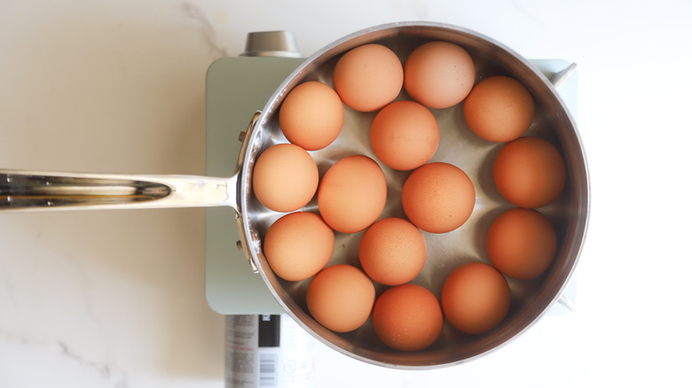 Eggs boiling in pot