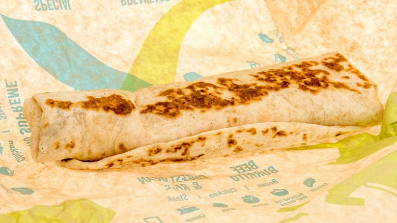 Taco Bell burrito on a brown piece of wrapping paper