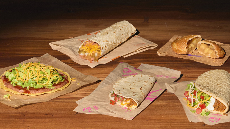 Several Taco Bell food items on a wooden table