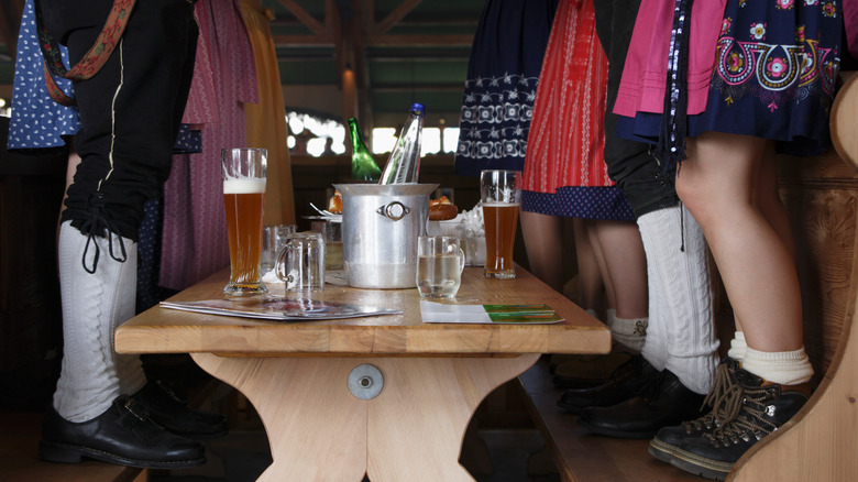 legs standing on Oktoberfest benches