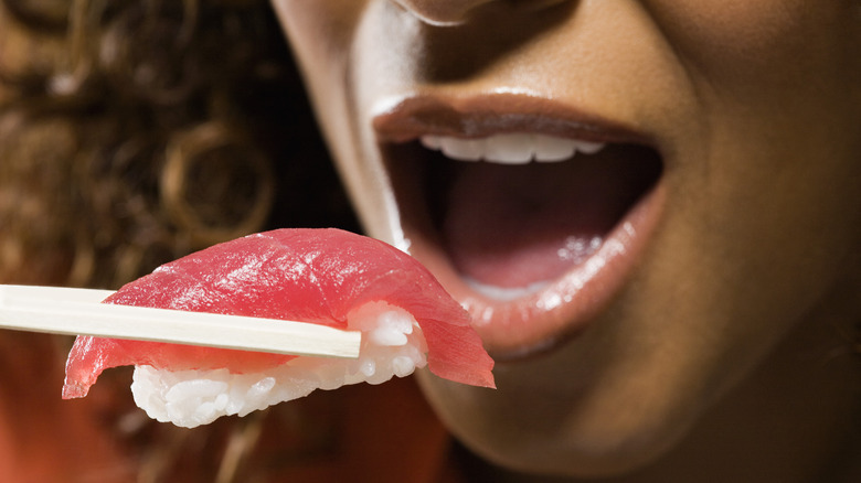 woman eating tuna