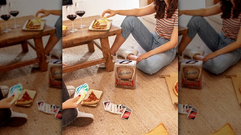 playing Uno with boxed wine