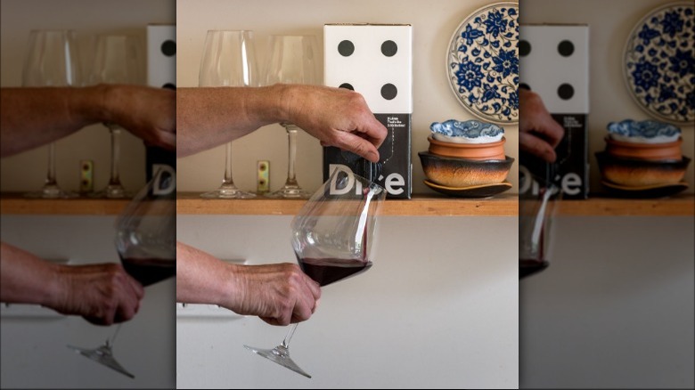 pouring wine glass from box