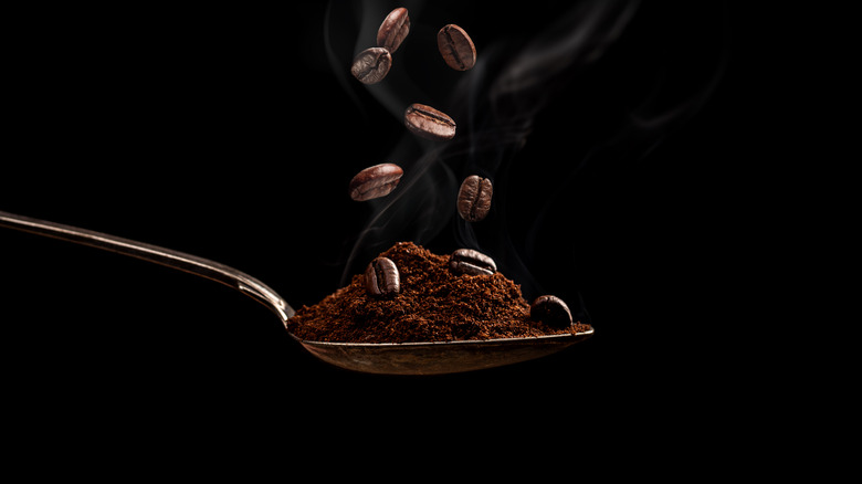 Spoon with ground coffee