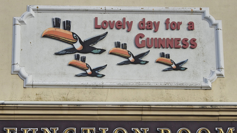 Guinness advertisement above pub