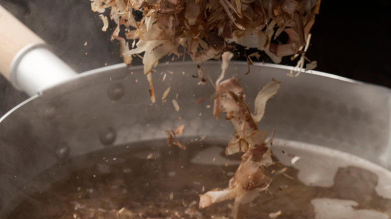 katsuobushi being added to water 