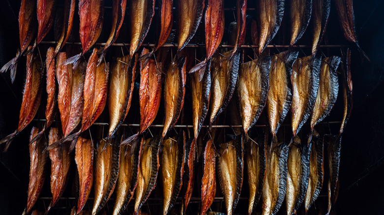 Smoking fish filletes hanging