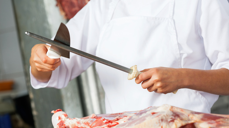 Chef using honing steel