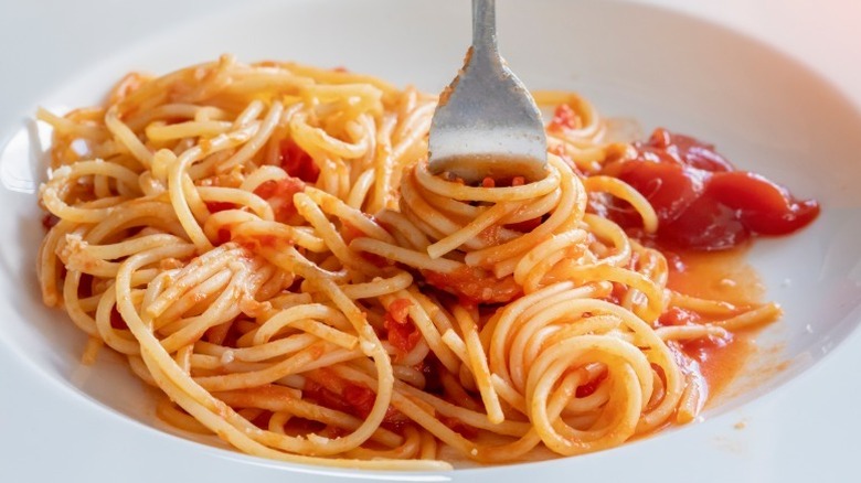 Bowl of spaghetti with ketchup