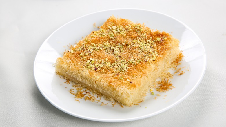 Homemade knafeh on white plate