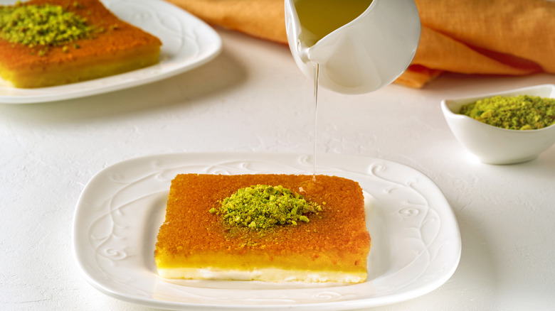 Syrup poured over knafeh