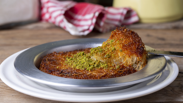 Crispy knafeh in metal dish