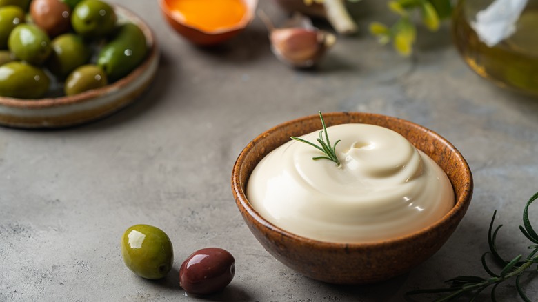 Bowl of mayonnaise with olives