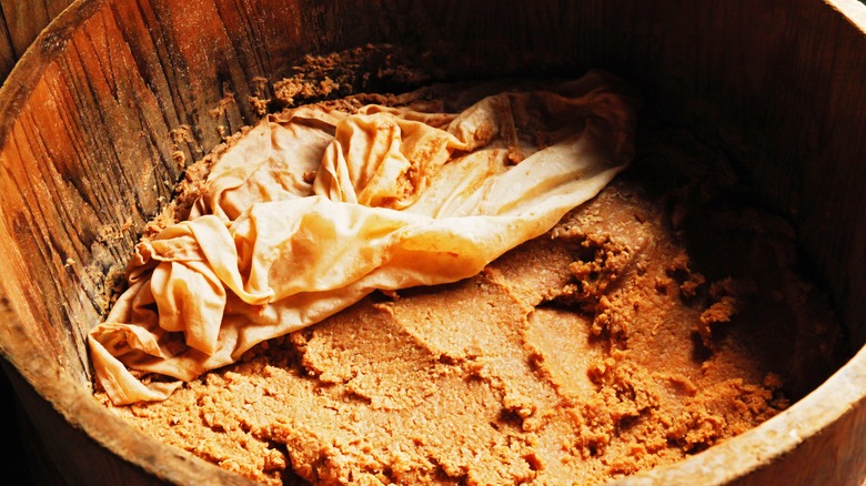 Miso fermenting in a barrel 