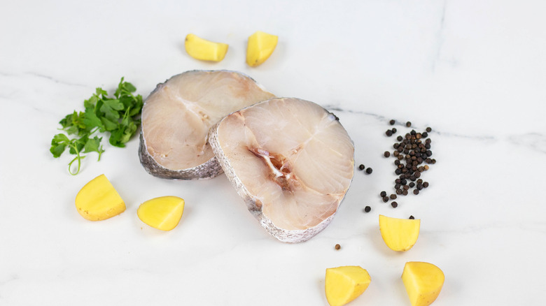 Monkfish steaks on table