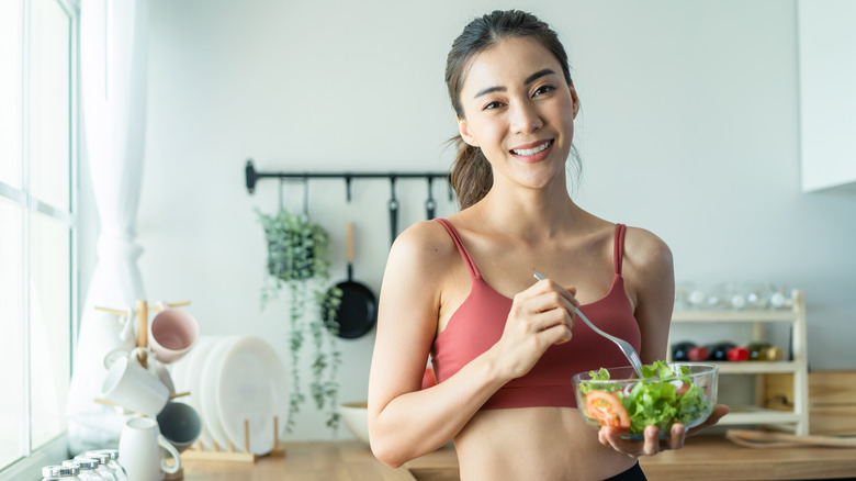 woman eating salad