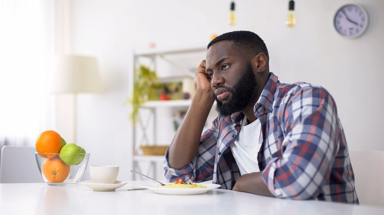 man with suffering look