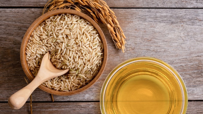 bowls of brown rice and oil