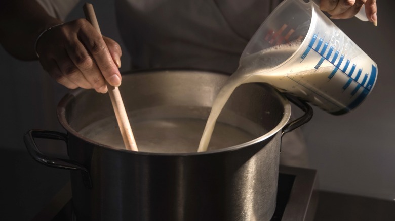 pouring milk into pot