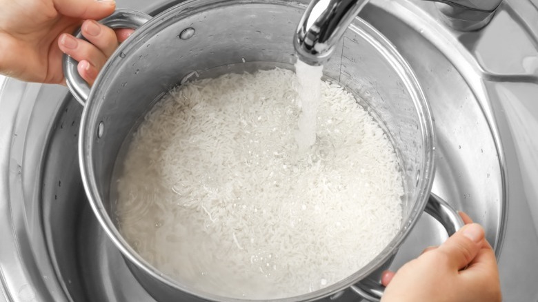 rinsing white rice in pot