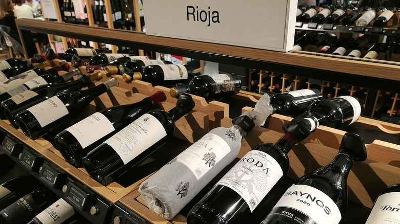 wine bottles on store shelf with rioja label