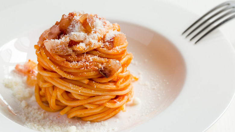 pasta all'amatriciana on white dish