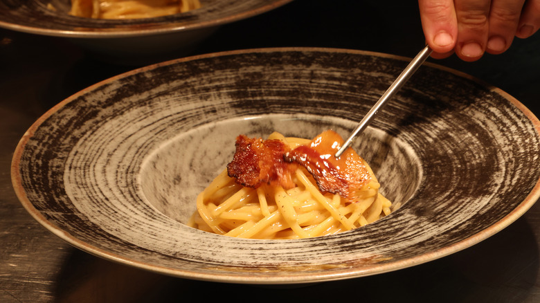 carbonara in gray pasta dish