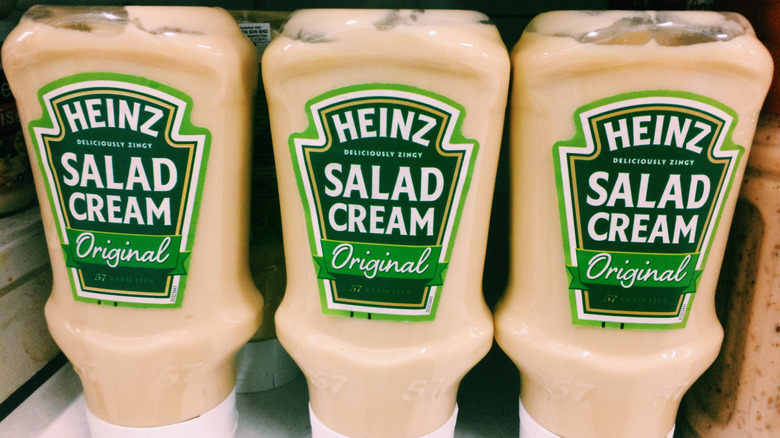 bottles of heinz salad cream on a grocery store shelf