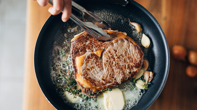 Searing steak in pan