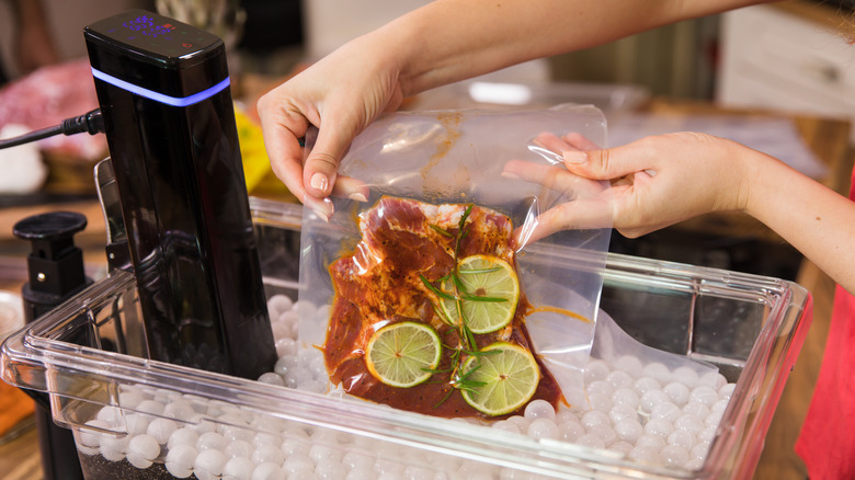 Adding steak to water bath