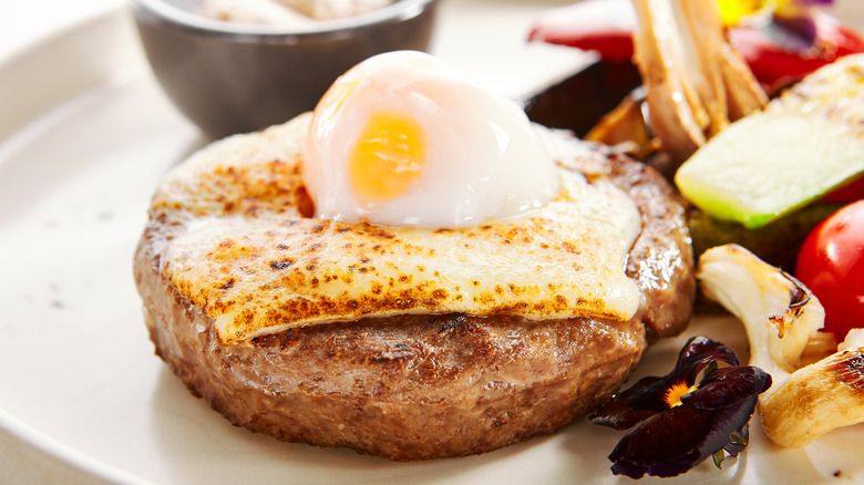 Sous vide egg on top of meat