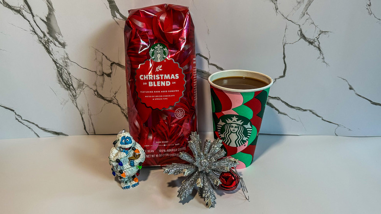 A bag of Starbucks Christmas Blend with coffee and Christmas ornaments