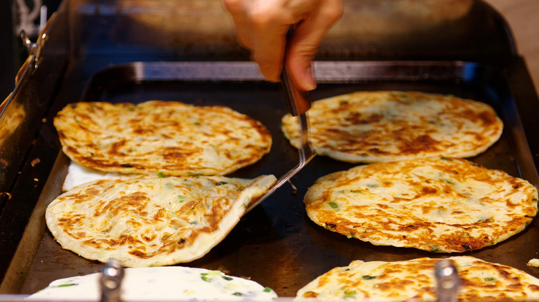 Scallion pancakes cooking