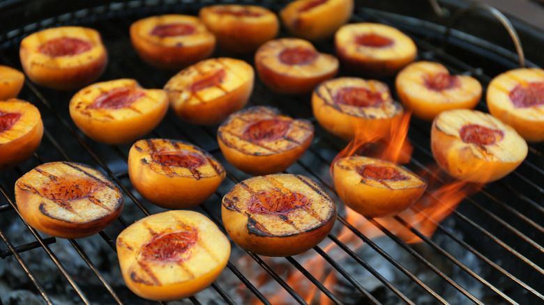 Peaches roasting on grill