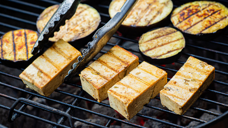Tofu cooking on grill 