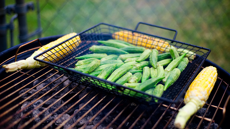 Okra cooking in grill basket