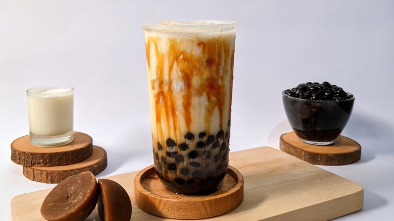 Bubble tea next to tapioca bubbles 