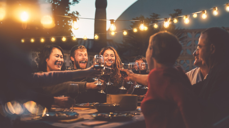 People drinking wine outside